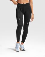 with elastic waistband and inner crossed cord for easy adjustment. High-visibility details. Front inner pocket. Elastic and body fitting fabric.