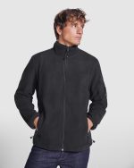 long sleeves and contrastin rib. Pocket with contrasting zip on left sleeve and front contrasting zip. Seams on sides and chest. Elbow pads in same fabric.