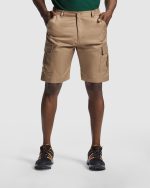 velcro fastening and    central bellows. · Two back pockets with button.
